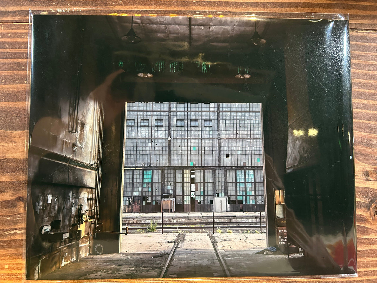 Reflective surface with a distorted view of Albuquerque Rail yard.