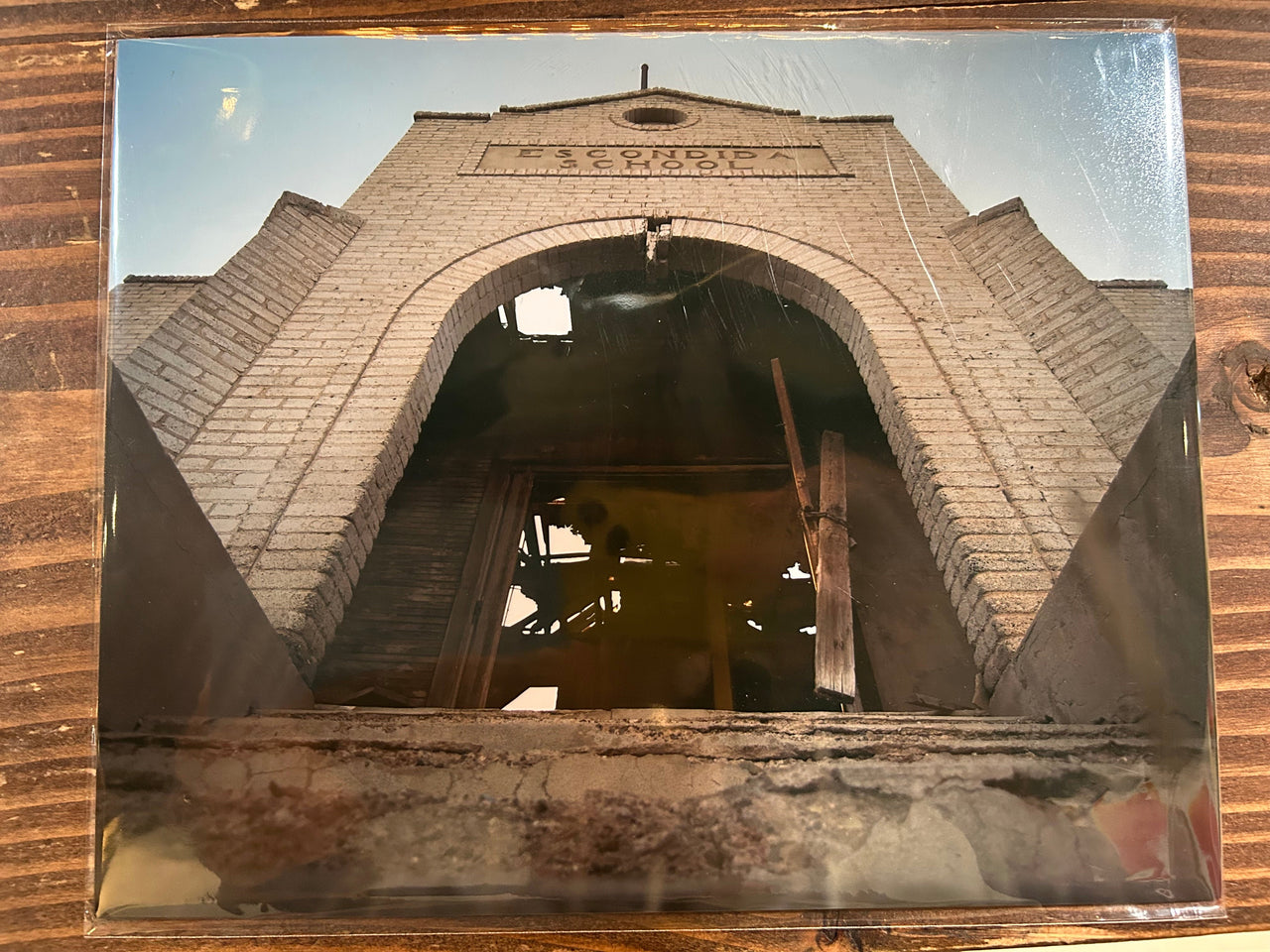 Architectural structure with a clock tower on a reflective surface