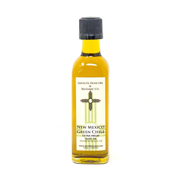 small 2 oz glass bottle of New Mexico Green Chili Olive oil.  Label has a green  and black Zias 